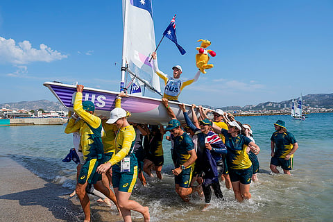 Matthew Wearn of Australia celebrates after winning the gold medal in ILCA 7 men's dinghy class final race 